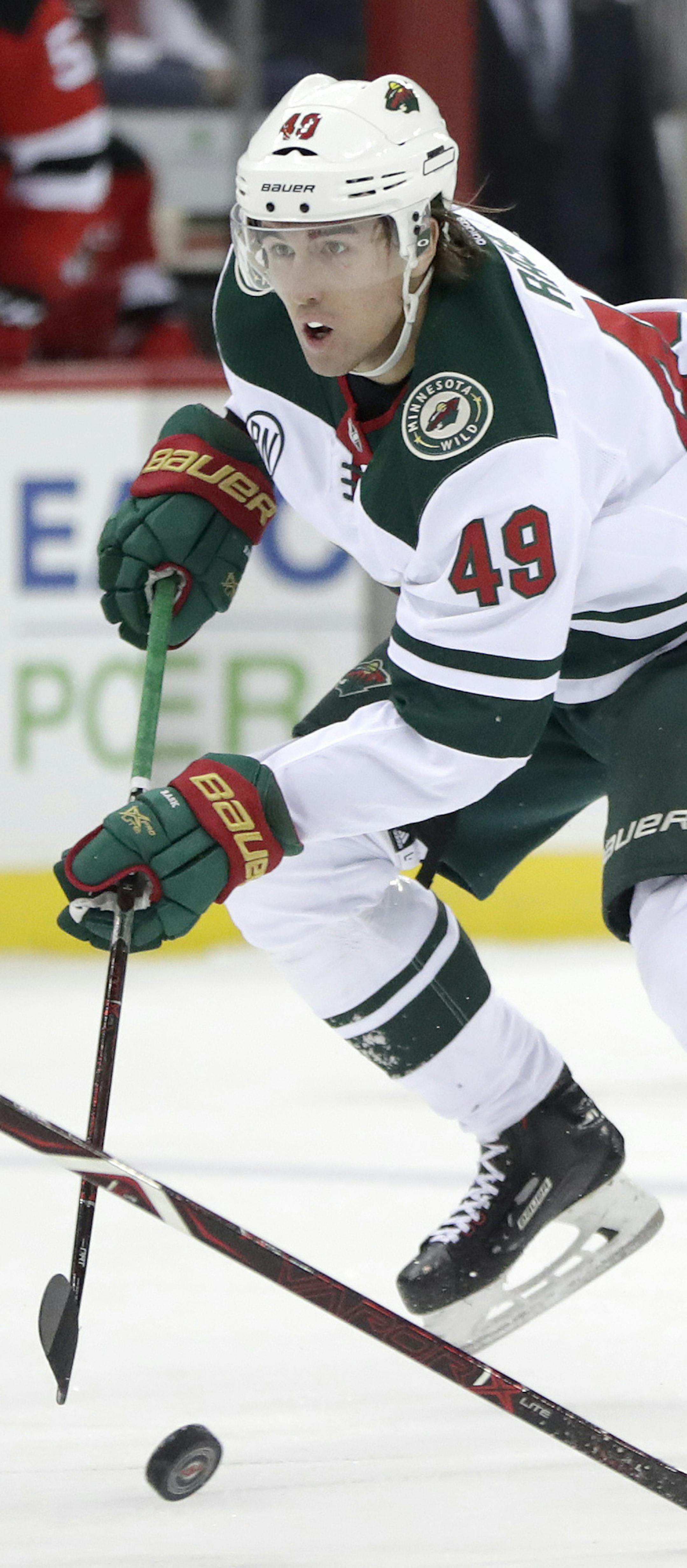 Minnesota Wild center Victor Rask (49), of Sweden, skates against New Jersey Devils defenseman Andy Greene (6) during the first period of an NHL hockey game, Saturday, Feb. 9, 2019, in Newark, N.J. (AP Photo/Julio Cortez)