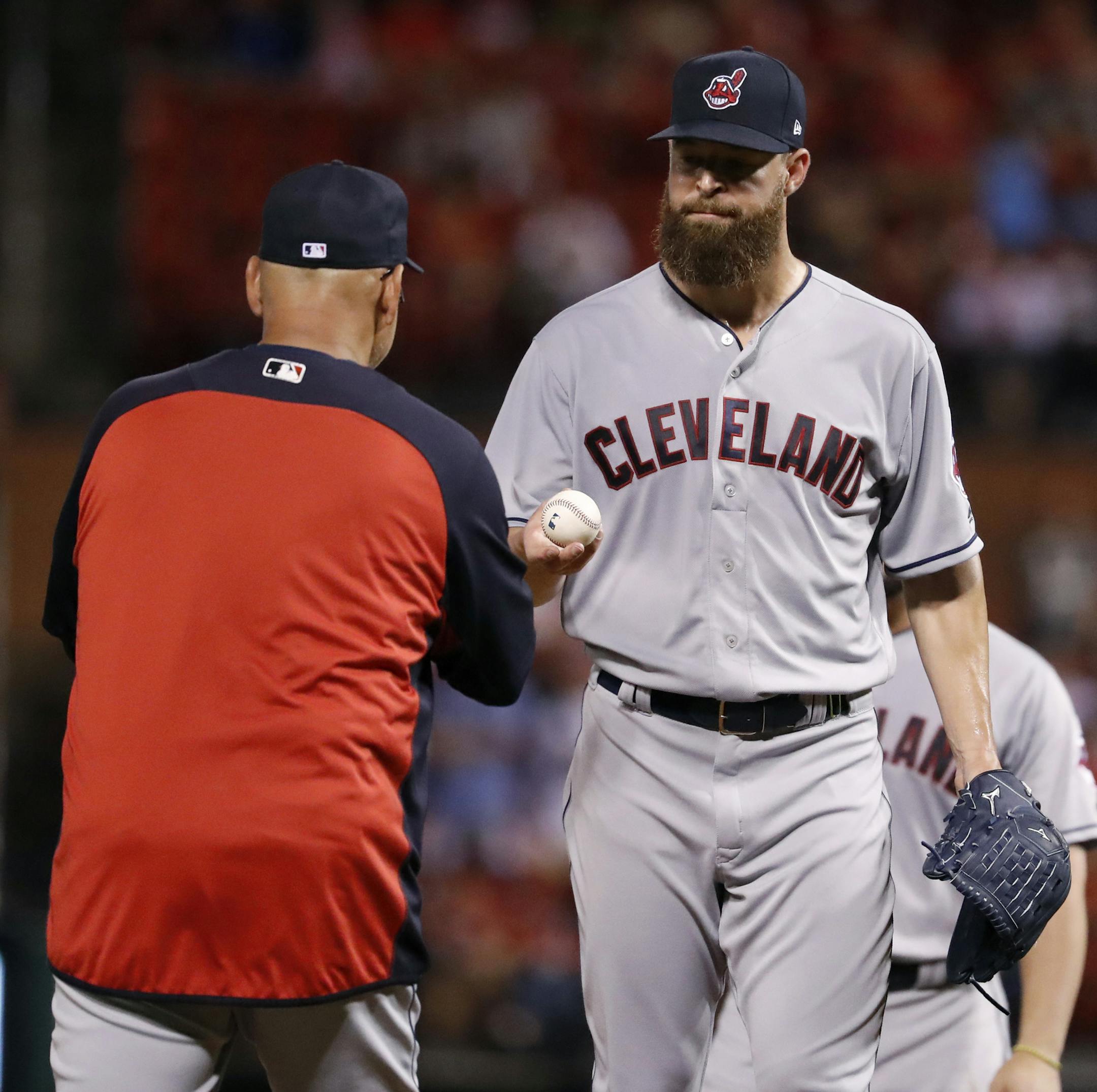 Cleveland Indians starting pitcher Corey Kluber, right, is removed by manager Terry Francona during the second inning of a baseball game against the St. Louis Cardinals Tuesday, June 26, 2018, in St. Louis. (AP Photo/Jeff Roberson)