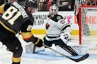 Minnesota Wild goaltender Cam Talbot (33) defends against a shot by Vegas Golden Knights center Jonathan Marchessault (81) during the second period of