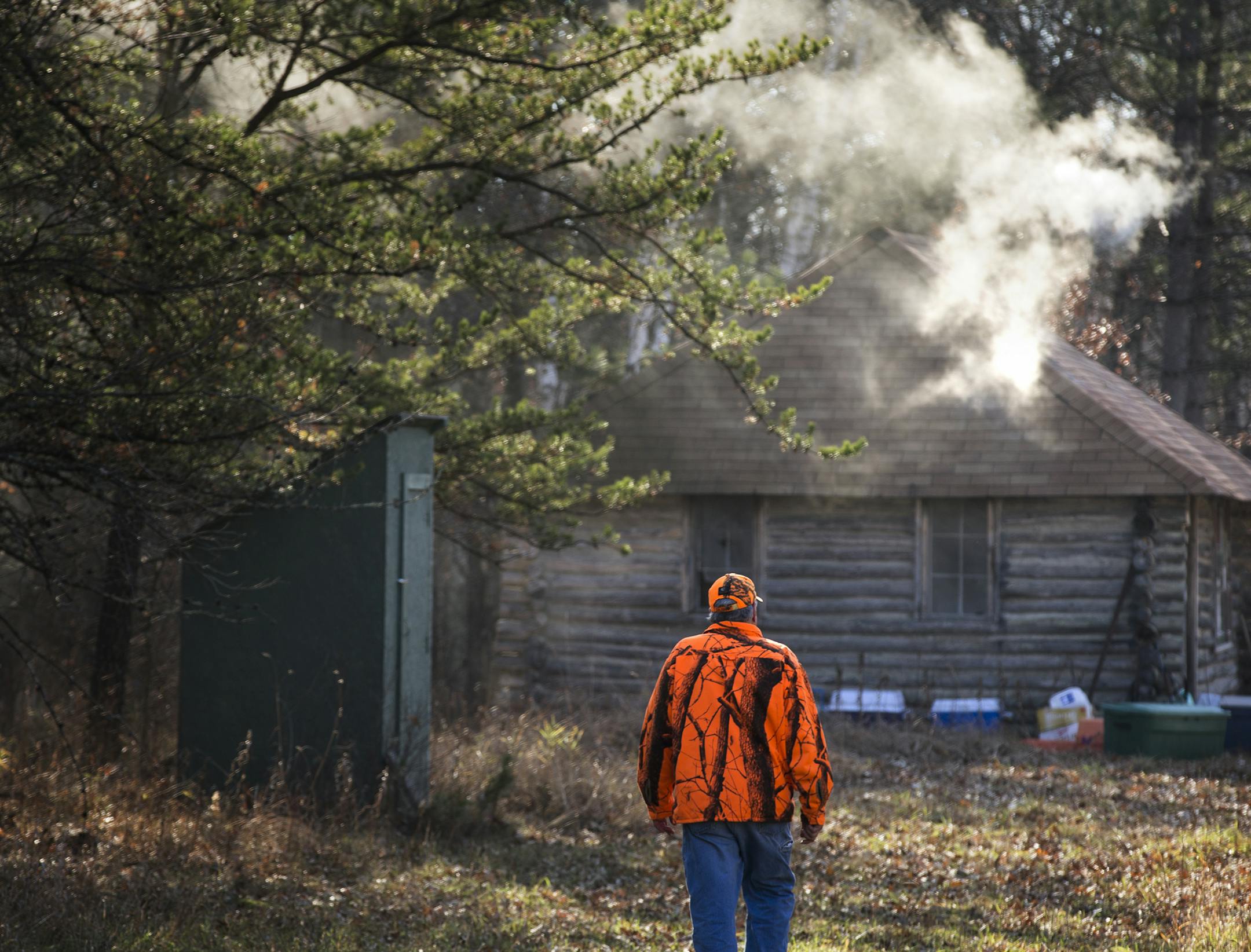 Bill Sloneker walks back to the cabin during deer opener weekend at the Sloneker family hunting cabin in Jenkins on Saturday, November 7, 2015. ] (LEILA NAVIDI/STAR TRIBUNE) leila.navidi@startribune.com