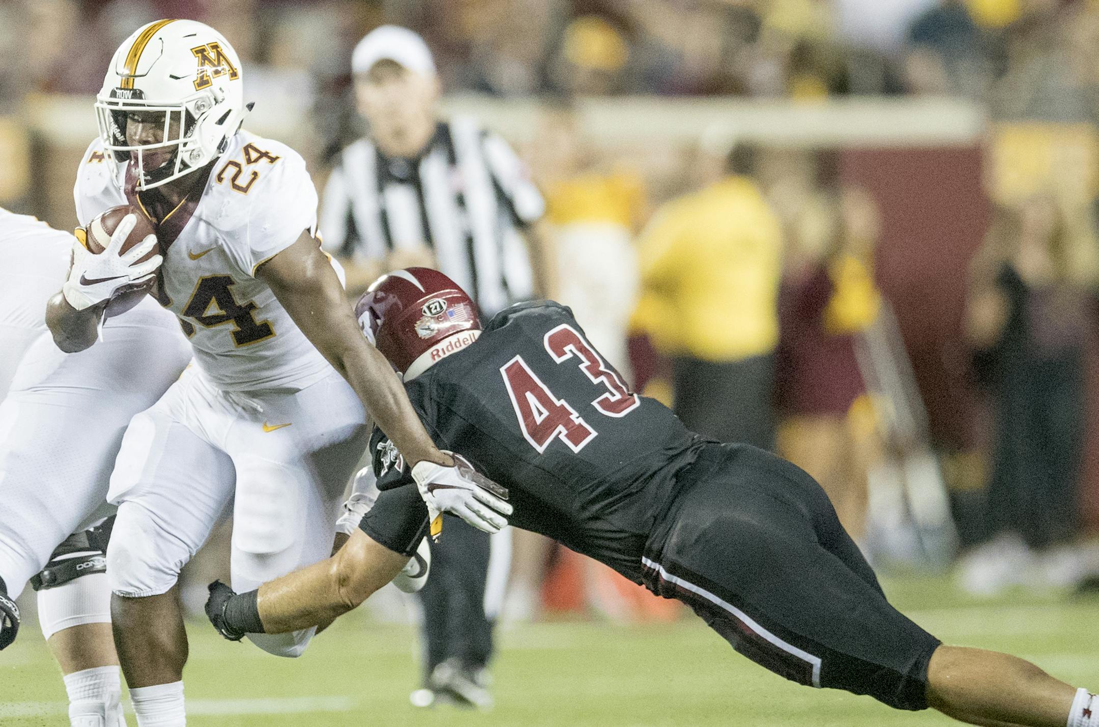 Minnesota's running back Mohamed Ibrahim rushed for yards despite defensive pressure from New Mexico State's linebacker Billy Nipp in the fourth quarter Minnesota took on New Mexico State at TCF Bank Stadium, Thursday, August 30, 2018 in Minneapolis, MN. ] ELIZABETH FLORES &#xef; liz.flores@startribune.com