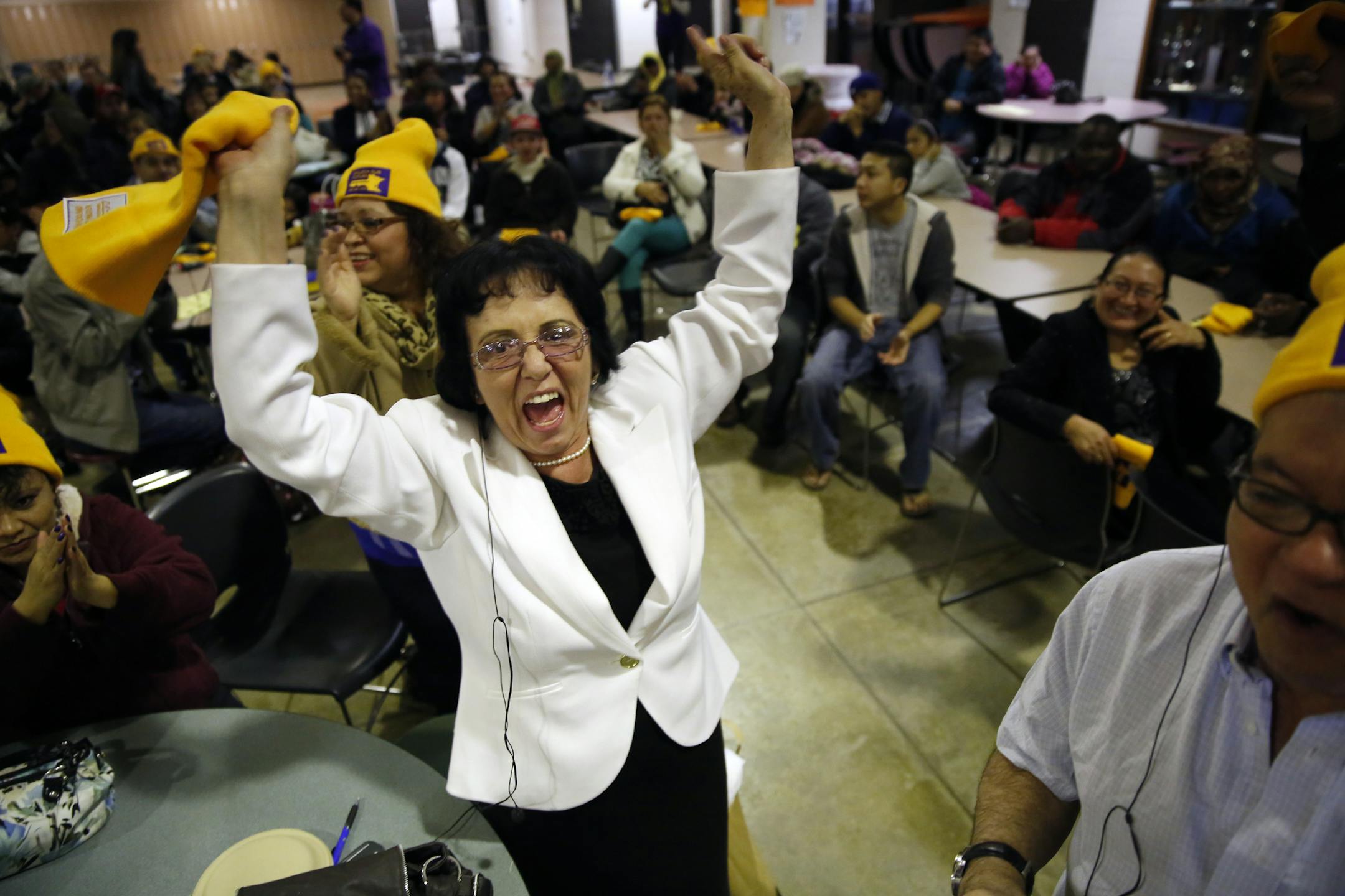 At South H.S. in Minneapolis, Margarita Del Angel, an office janitor celebrated recent gains in pay and health benefits. She was there to encourage retail janitors and security guards to secure better pay and benefits .]rtsong-taatarii@startribune.com