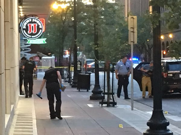 Minneapolis police investigate a shooting downtown Tuesday night near 6th Street and Hennepin Avenue that left a bystander wounded.