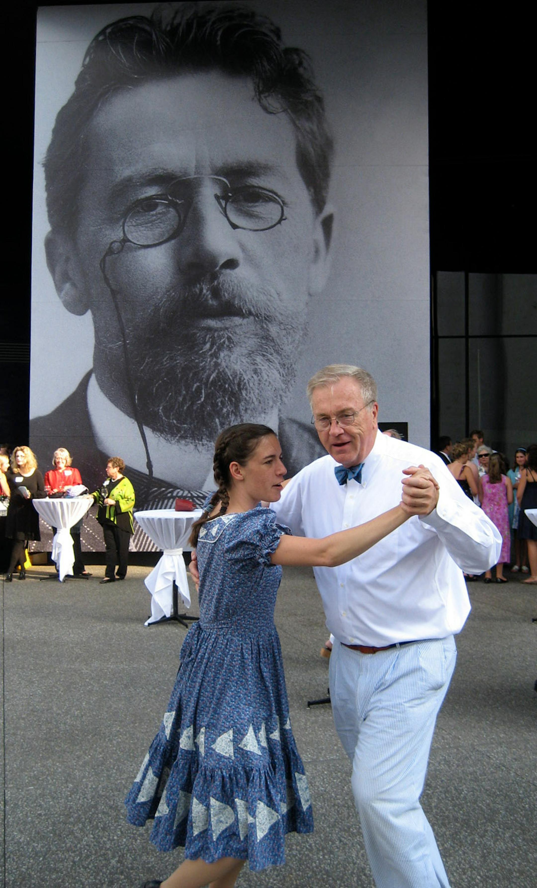 Guthrie donor Jack Hoeschler, a member of the "Little House" chorus, and Sarah King of the Wild Goose Chase Cloggers, gave it a whirl.
