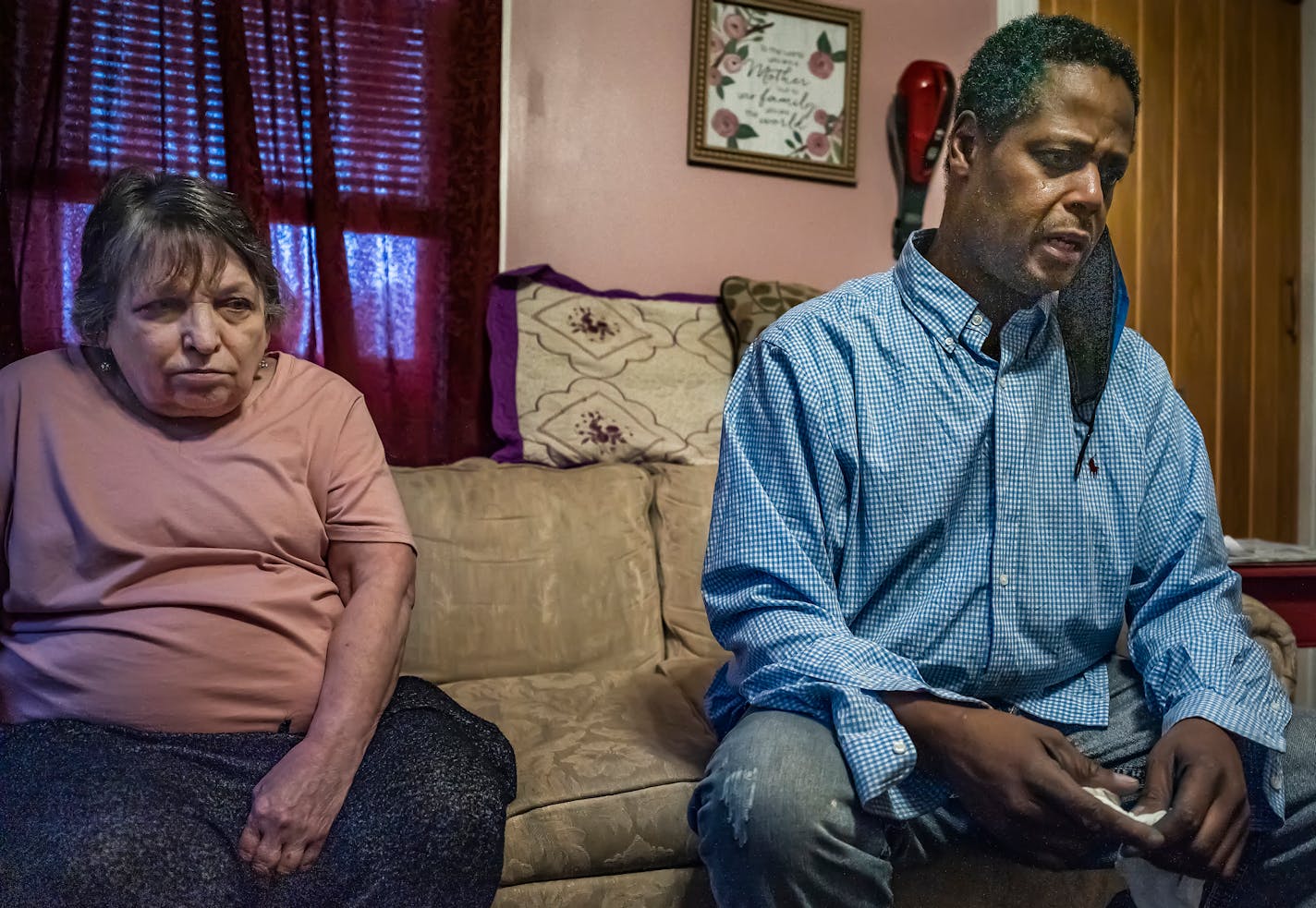 In Minneapolis, Minnesota on April 14, 2021, (L to R) Andre Moore described his experience with police. He suffers PTSD from the treatment he suffered at the hands of cops who targeted him with trumped up felony drug charges. Shirley Pikala, left has been like a mother to Moore allows him to spend a lot of time at her place. ] Moore's isn't the only case that's been thrown out after a Minneapolis police officer was accused of fabricating evidence and making up criminal informants in order to obtain a warrant.