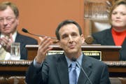 Gov. Tim Pawlenty saluted National Guard Sgt. Chad Malmberg, a Silver Star recipient, during his State of the State address Thursday in the state Hous