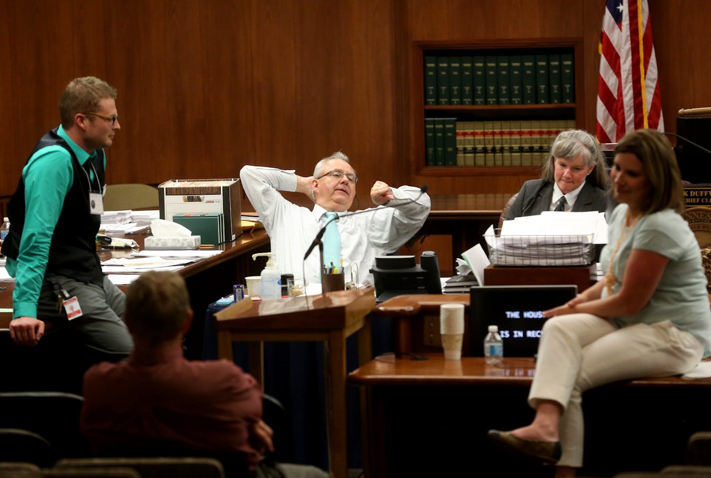 Minnesota House aides and members chatted and chilled as the chamber was in recess. The session went well into the morning hours on Saturday. For more photos from the overnight session, visit startribune.com.