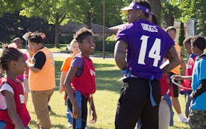 Minnesota Viking Stefon Diggs plays flag football with children at a grant celebration event in St. Paul last spring. The Sanneh Foundation received m