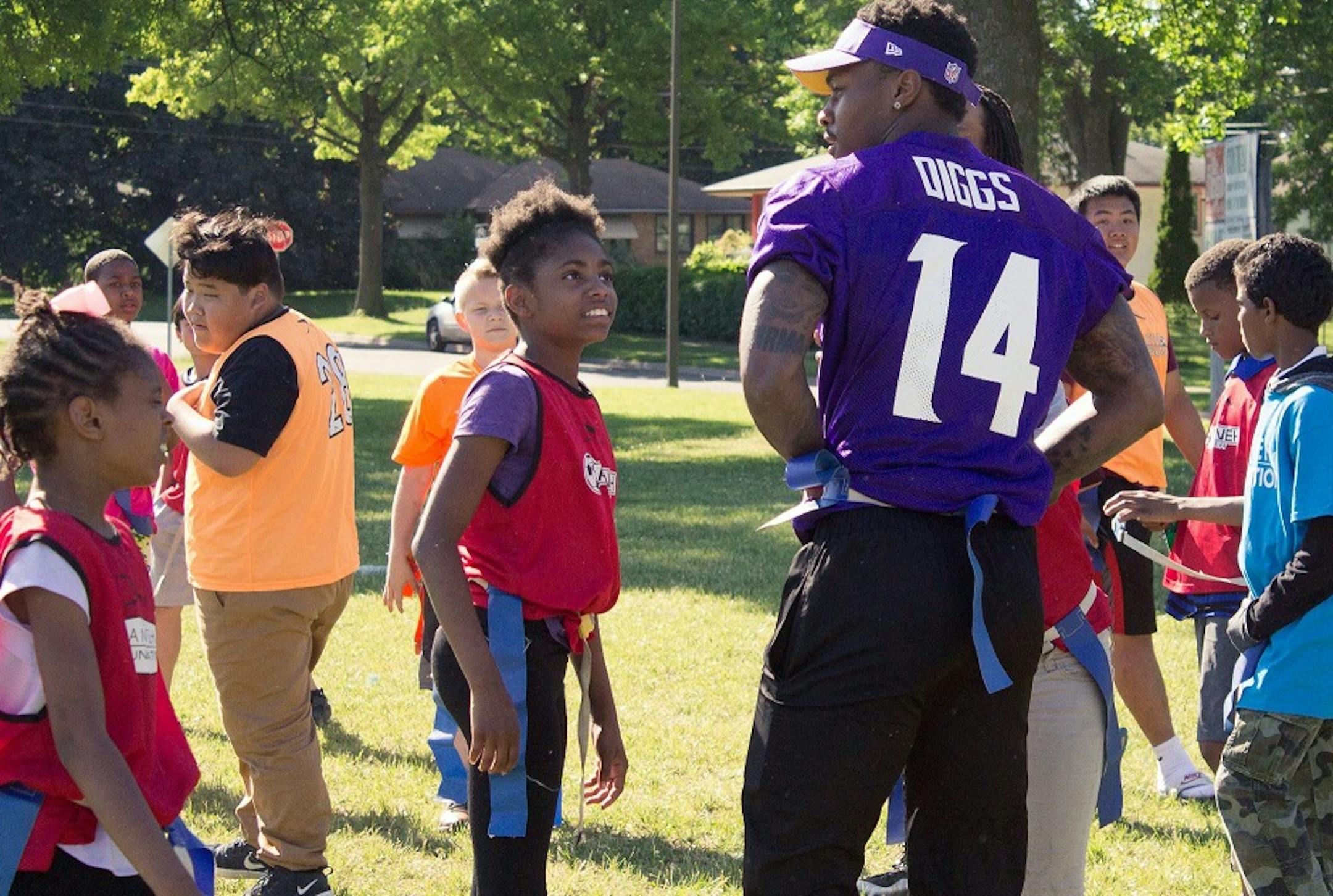 Minnesota Viking Stefon Diggs plays flag football with children at a grant celebration event in St. Paul last spring. The Sanneh Foundation received money to upgrade the gym floor at the Conway Community Center.
source: U.S. Bank
