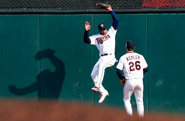 Twins center fielder Byron Buxton accepted his Defensive Player of the Year award from Wilson Sporting Goods before Monday's game against the Astros.