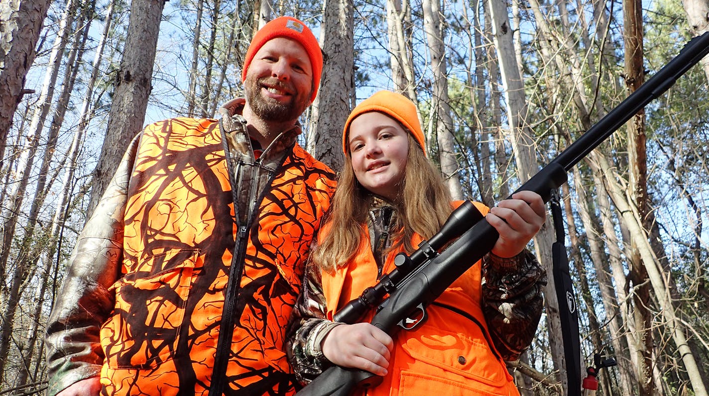 Zeb McInerny with his 13-year-old daughter, Ella, on Friday afternoon outside their home in rural Rockford. The family won a hunting license lottery for the privilege of hunting at Afton State Park for opening weekend of the firearms deer season. Sixty deer tags at the park were issued to 30 youngsters, each partnered with an adult mentor. Photo By Tony Kennedy