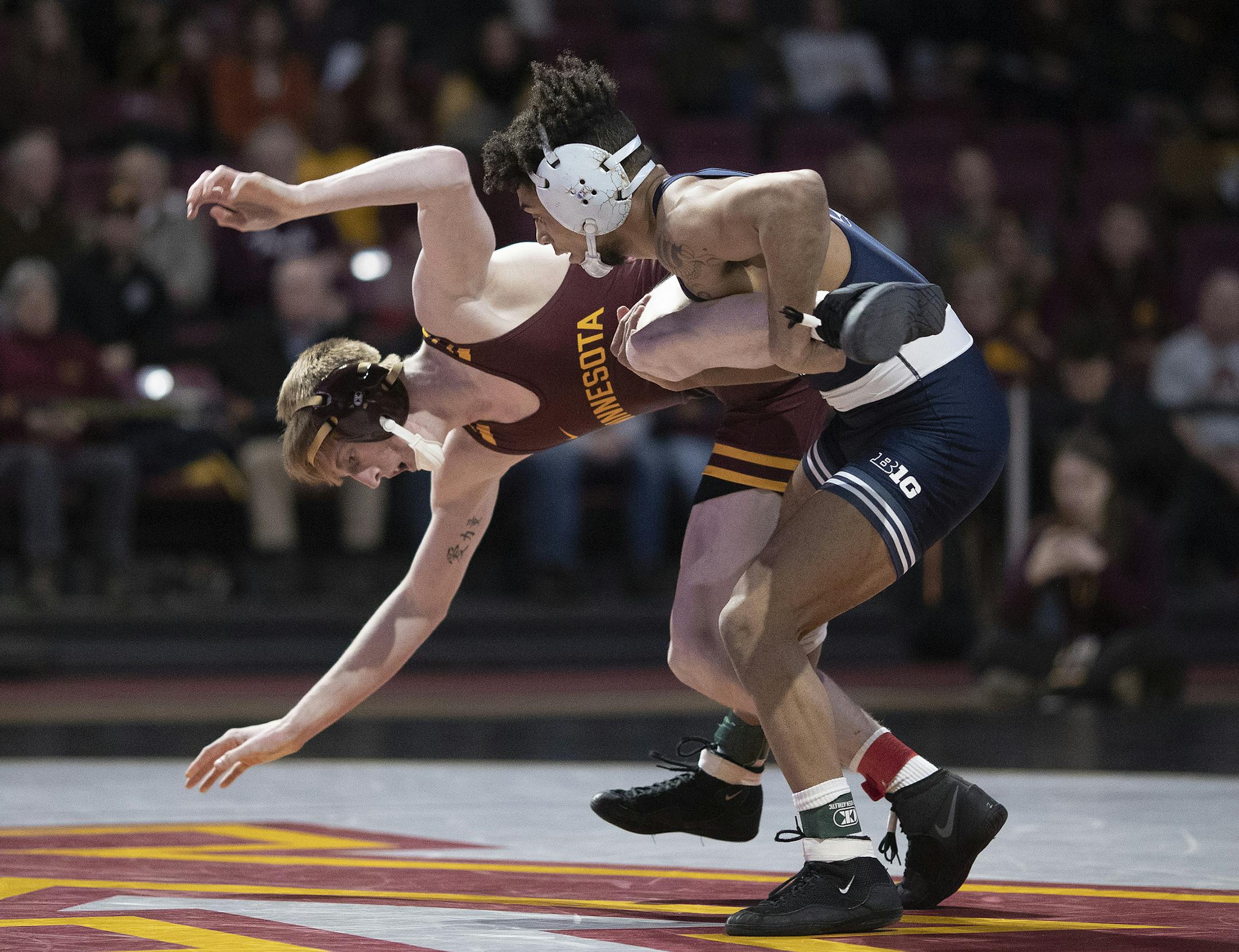 Penn State's Roman Bravo-Young scored two points on a takedown over Minnesota Boo Dryden in the 133 pound division.] Jerry Holt •Jerry.Holt@startribune.com Gophers wrestling dual meet against defending NCAA champ Penn State Sunday February 9, 2020 at Maturi Pavilion on the University of Minnesota campus in Minneapolis,MN.