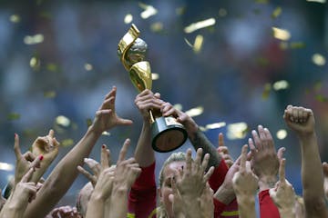 The United States Women's National Team celebrates with the trophy after they defeated Japan 5-2 in the FIFA Women's World Cup soccer championship in 