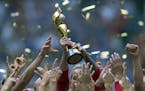 The United States Women's National Team celebrates with the trophy after they defeated Japan 5-2 in the FIFA Women's World Cup soccer championship in 