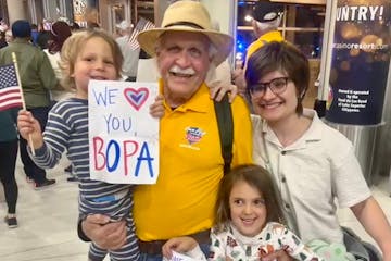 Doug Heiken returned from an Honor Flight on Saturday to be greeted by some of his grandchildren at the Duluth International Airport.