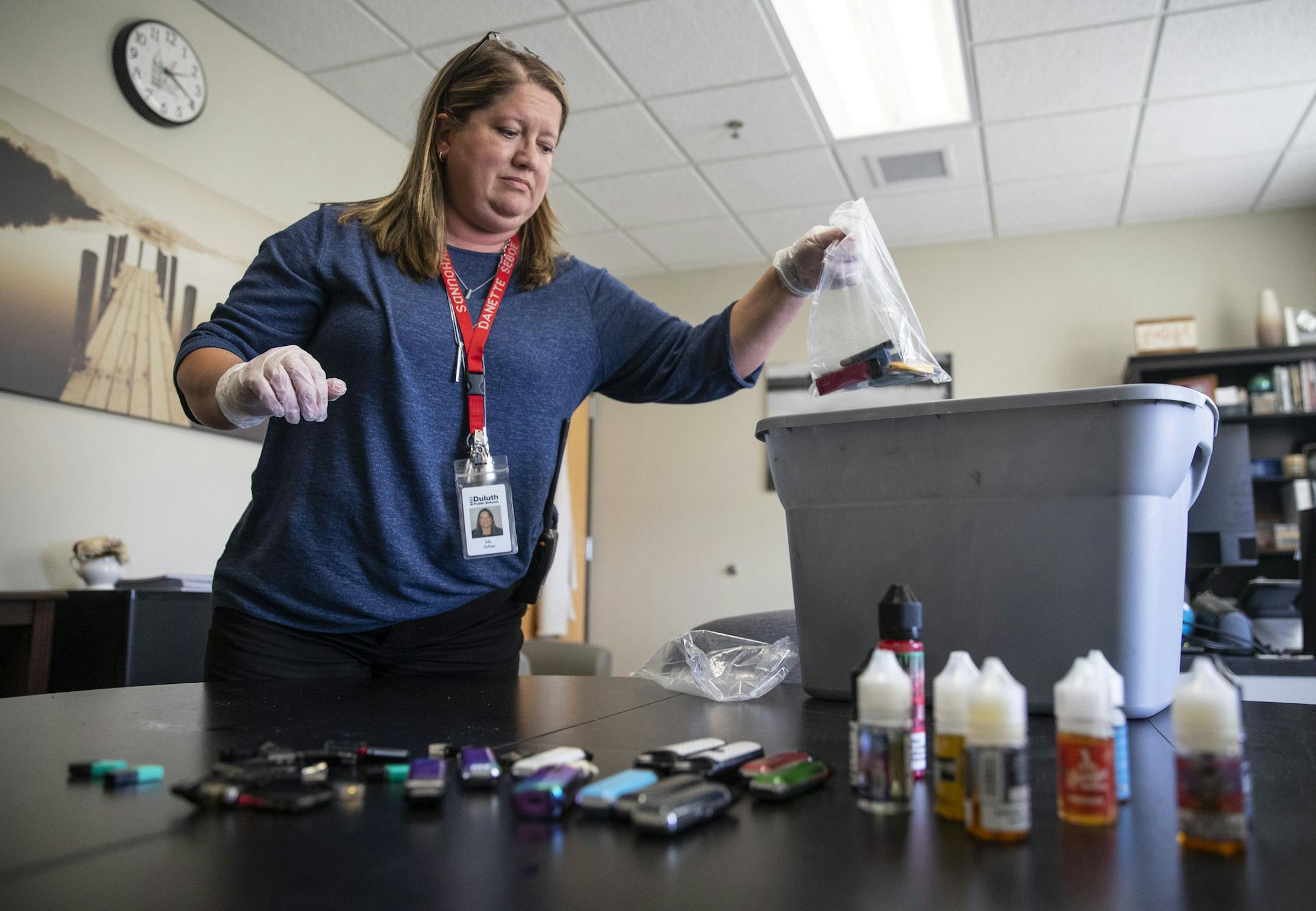 "There's nothing to call it but an epidemic. It hit so fast and so hard," said Duluth High School Principal Danette Seboe, seen with vaping devices confiscated since March.