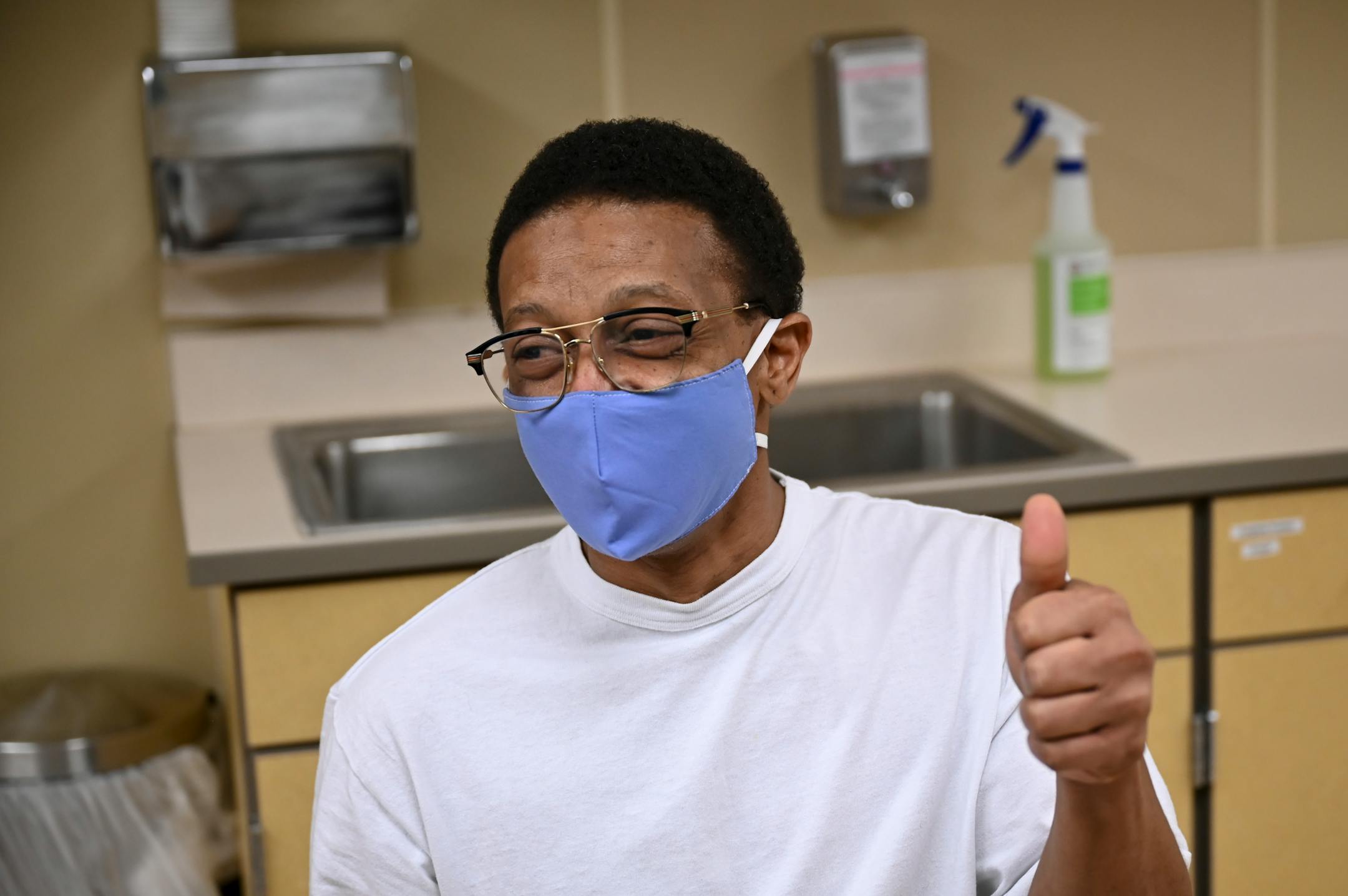 Edward Anderson, an inmate at Faribault Prison, gave the thumbs up after being the first prisoner to receive a COVID-19 vaccination in the state.