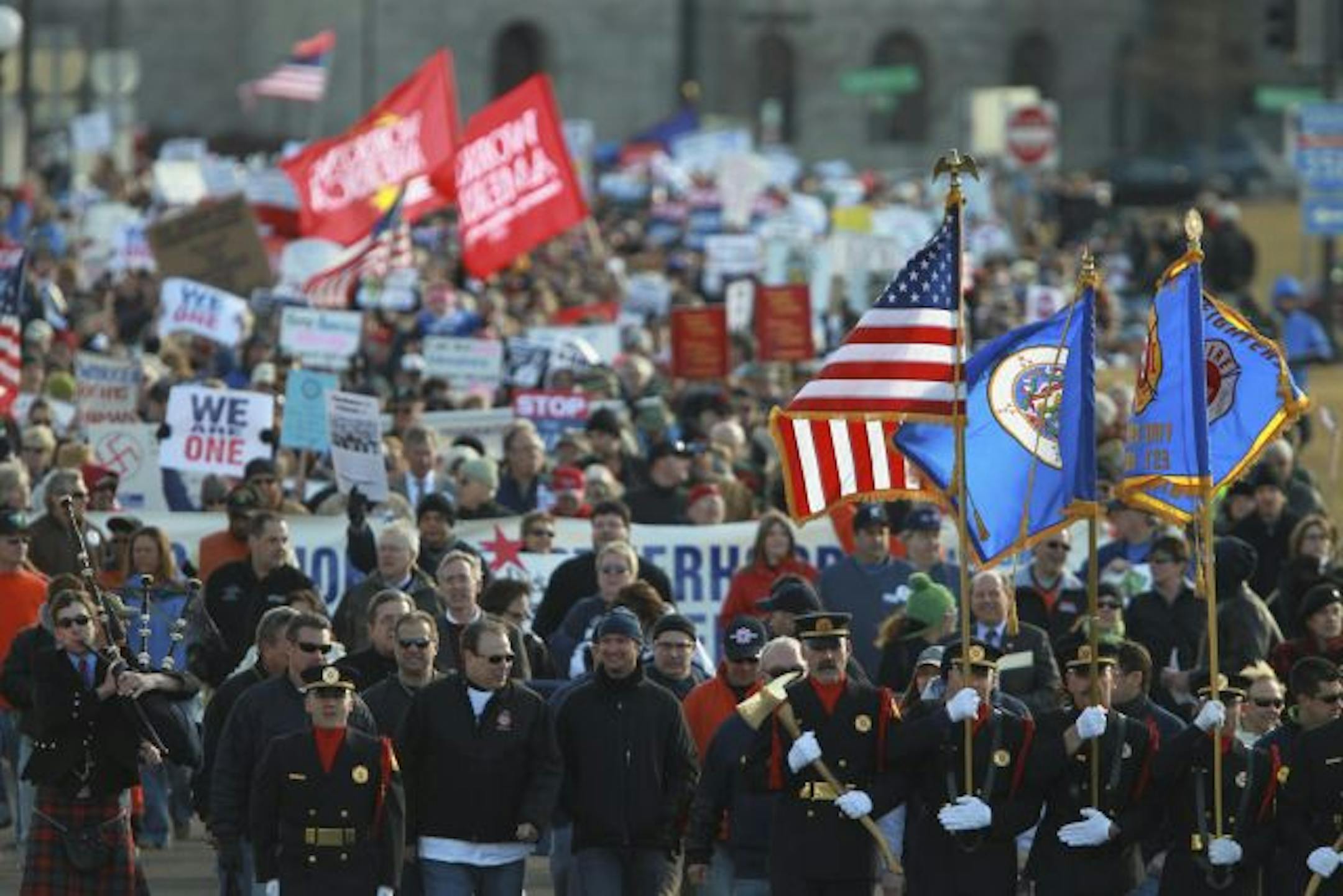 Led by an honor guard of firefighters, thousands of union supporters marched from the Cathedral down John Ireland Blvd. to the State Capitol Monday afternoon in what was billed as The March for the Middle Class.