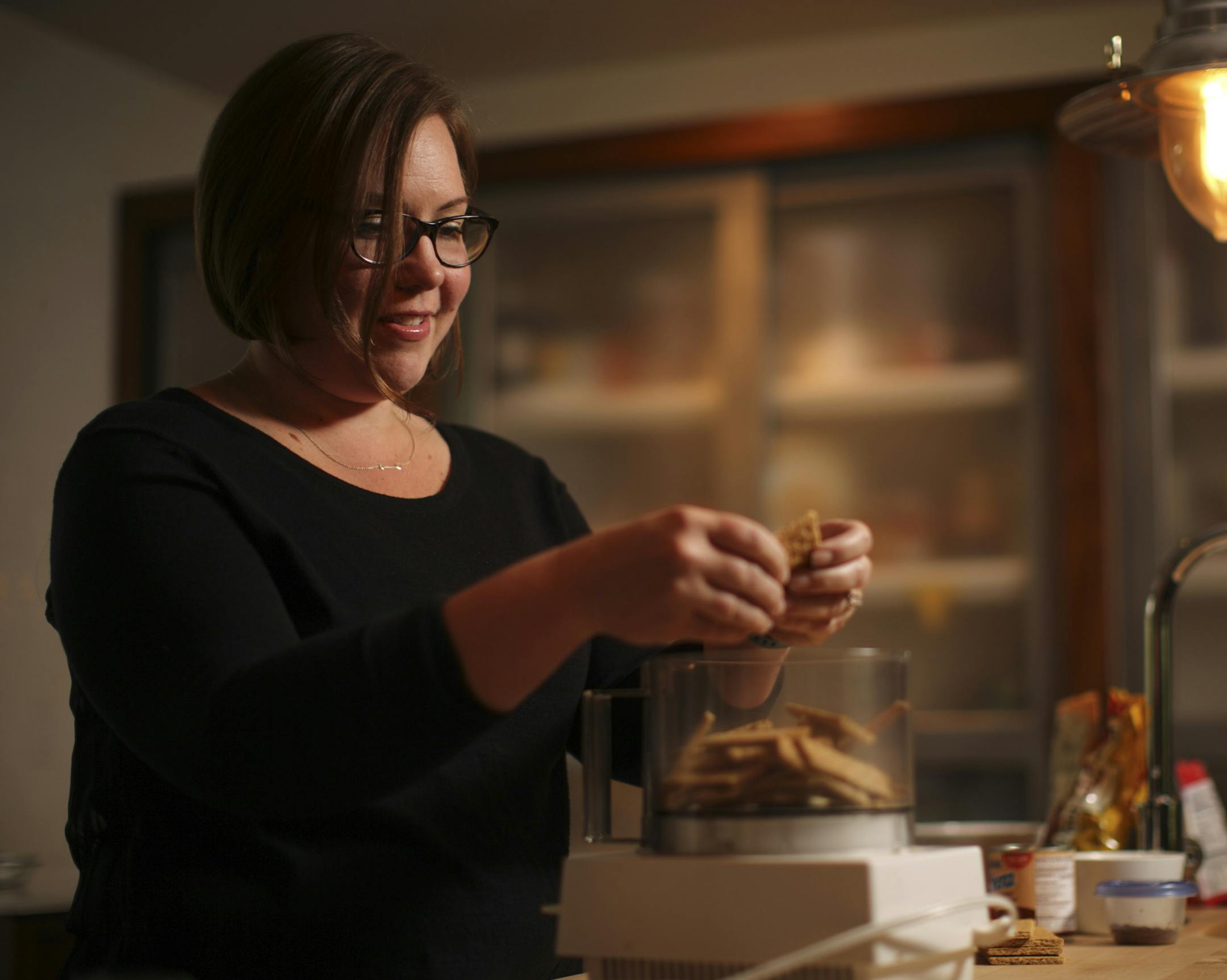 Pamela Phelan dropped graham crackers in her food processor while refining her version of a graham cracker crust in her kitchen in Fridley Wednesday night. ] JEFF WHEELER ‚Ä¢ jeff.wheeler@startribune.com Fridley 49er Days will feature a pie-baking contest for the second year. At the urging of a neighbor, Pamela Phelan decided to enter, even though she's never baked a pie before. She settled on an ice cream pie. She made a test pie this week and Wednesday night, June 25, 2014 she
