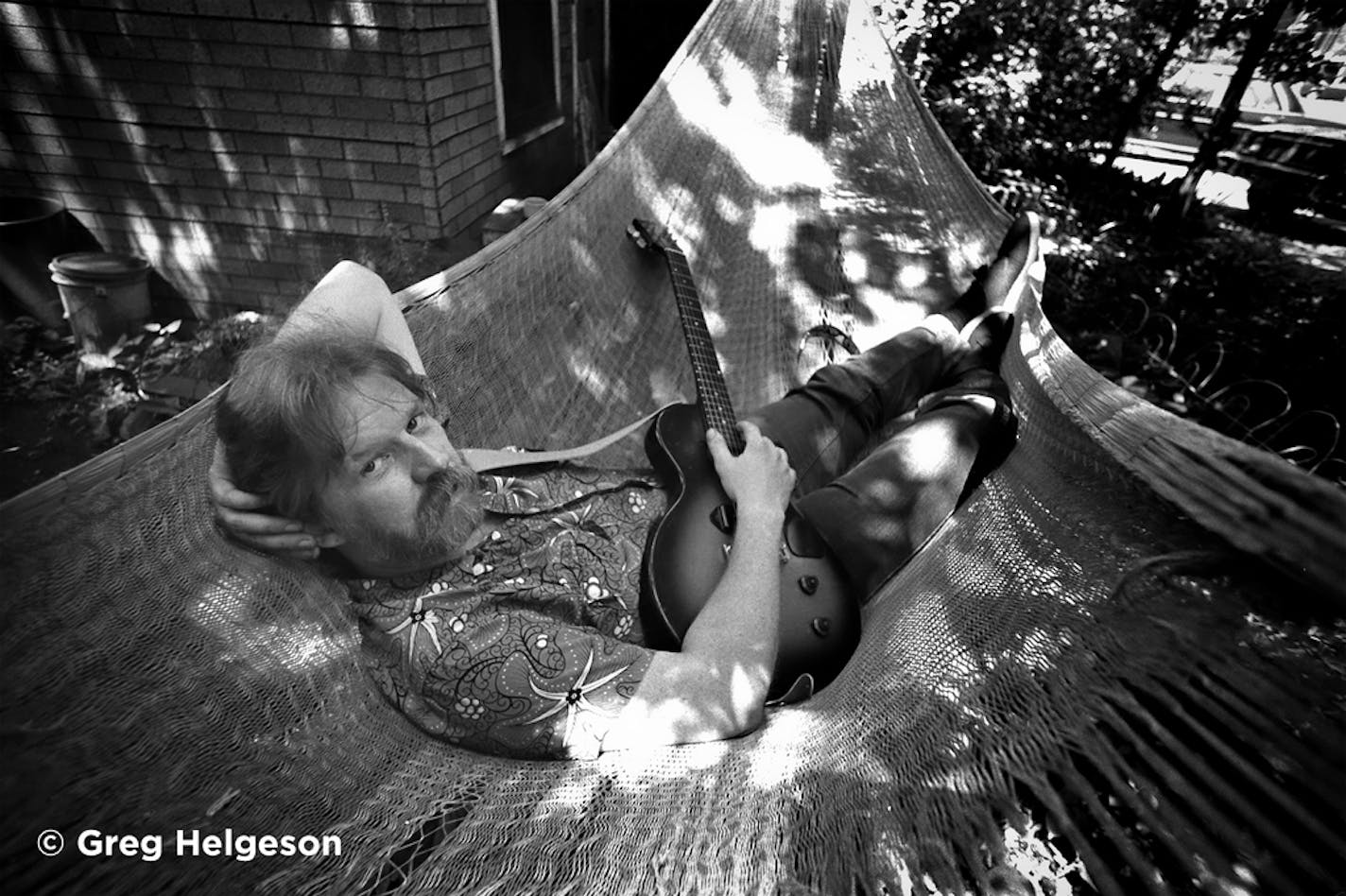 The late Willie Murphy struck a relaxed pose for a portrait in the backyard of his West Bank home.