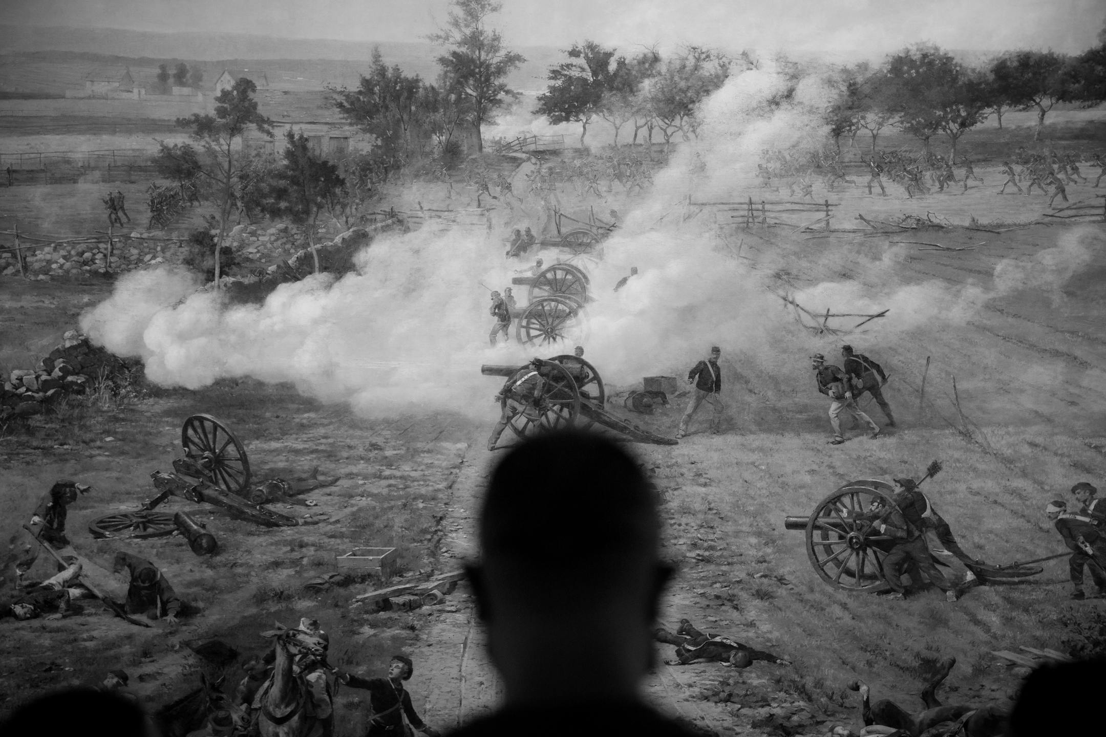 FILE — A visitor views the Gettysburg Cyclorama, depicting the final and decisive battle in the three day engagement, in Gettysburg, Pa., Aug. 7, 2020. To some who study civil conflict, an American crackup has come to seem, if not obvious, then far from unlikely — especially since January 6, Michelle Goldberg writes. (Damon Winter/The New York Times)