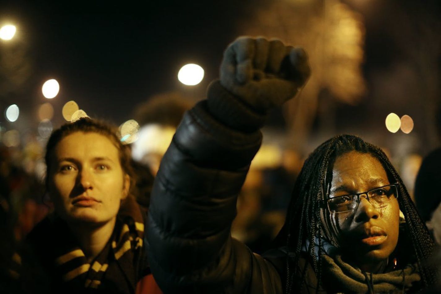 Tears flowed from the eyes of British Holloman as she listened to the Sam Cooke song "A Change Is Gonna Come" during a concert in front of the Fourth Precinct station on Tuesday in Minneapolis.