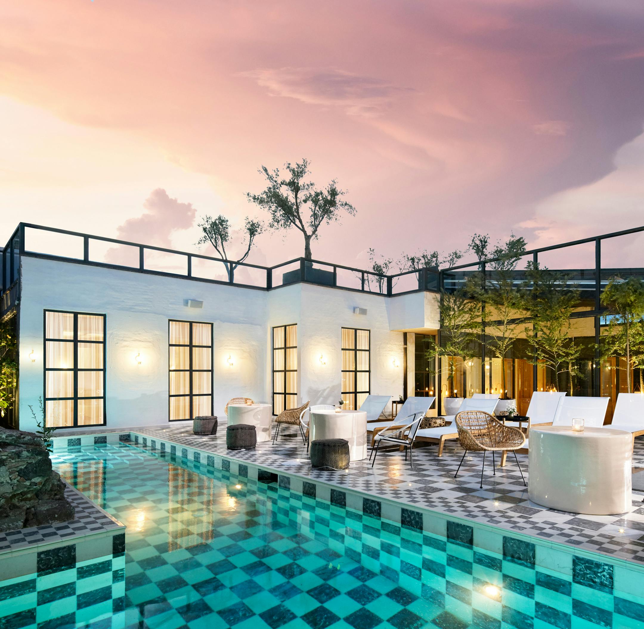 -- PHOTO MOVED IN ADVANCE AND NOT FOR USE - ONLINE OR IN PRINT - BEFORE SUNDAY, APRIL 1, 2018. -- In an undated photo provided by Edgardo Contreras, the patio and pool at L’Otel at Dôce-18 Concept House in San Miguel de Allende, Mexico. Opened in November 2016 in what was once a metals factory, the hotel has a fresh vibe — from zigzag floor tiles to floral wall murals — with shared spaces that include a sitting room with a grand piano and a library stocked with books li