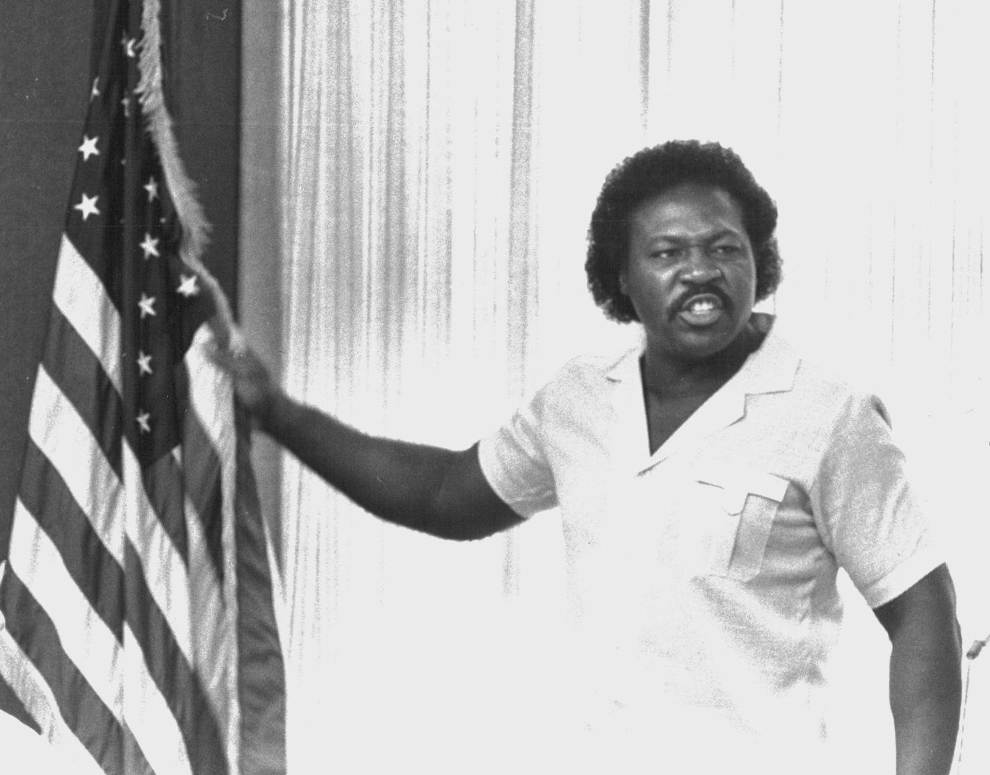 July 3, 1984 Spike Moss, with his hand on the flag, told the committee: "The black people of this country gave birth to the civil rights movement." With his hand on the U.S. flag behind the committee chairs, Spike Moss, head of the Black Leadership Association, said, "It's time to be clear. The black people of this country gave birth to the civil rights movement... White people don't experience what we experience. We come into this world without any rights and we go out without any rights. I'm n