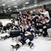The Chanhassen Sorm struck a state tournament pose after beating defending state champion Minnetonka to win a spot in the Class 2A hockey tournament.
