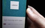 FILE - In this Friday, Sept. 22, 2017 file photo, an Uber App is displayed on a phone in London. Britain's Employment Appeal Tribunal Friday Nov. 10, 