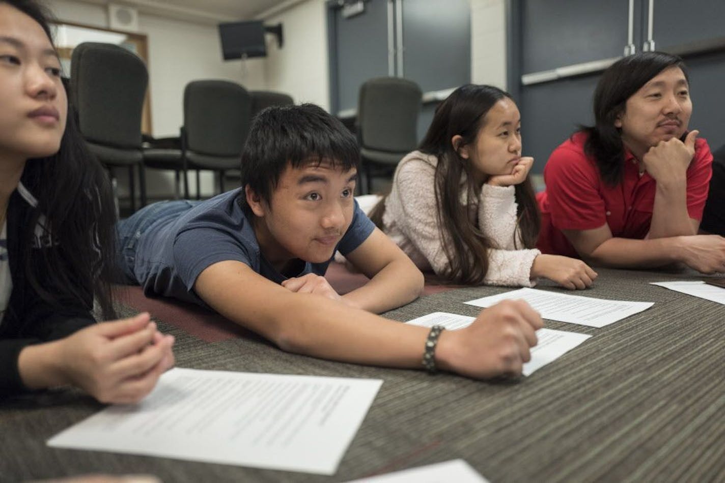 Anna Hang left, ChueKongPheng Xiong, Mai Lee Chang and Kurt Blomberg (teacher), members of the student leadership group, formed a circle at Johnson High School in this May 10, 2018 photo.