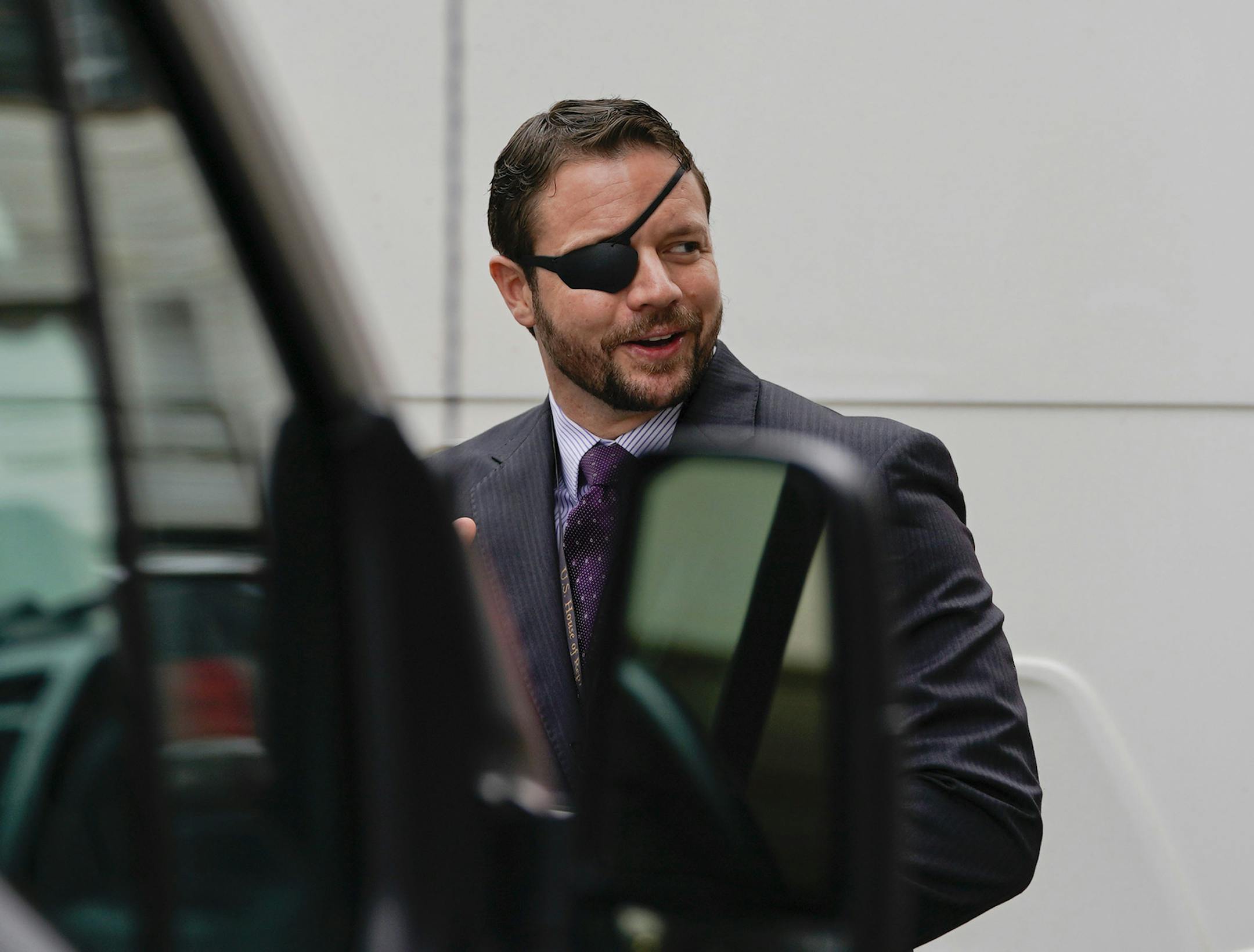 Rep.-elect Dan Crenshaw, R-Texas, leaves after attending orientation for new members of Congress, Tuesday, Nov. 13, 2018, in Washington. (AP Photo/Pablo Martinez Monsivais)