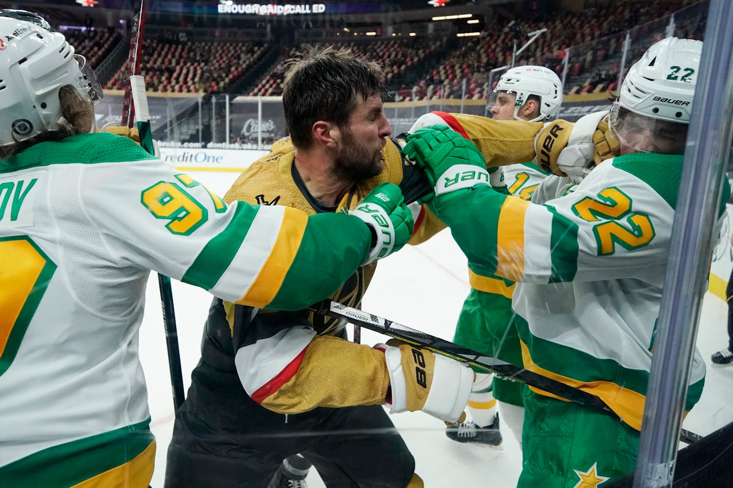 Vegas Golden Knights defenseman Alex Pietrangelo (7) punches Minnesota Wild left wing Kevin Fiala (22) during the third period of an NHL hockey game Wednesday, March 3, 2021, in Las Vegas. (AP Photo/John Locher)