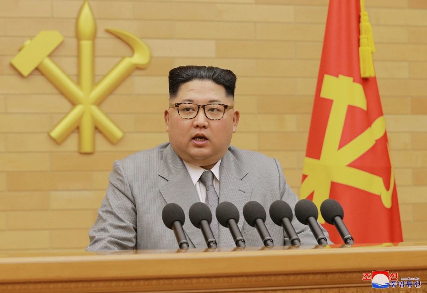 In this photo provided by the North Korean government, North Korean leader Kim Jong Un delivers his New Year's speech at an undisclosed place in North Korea Monday, Jan. 1, 2018.