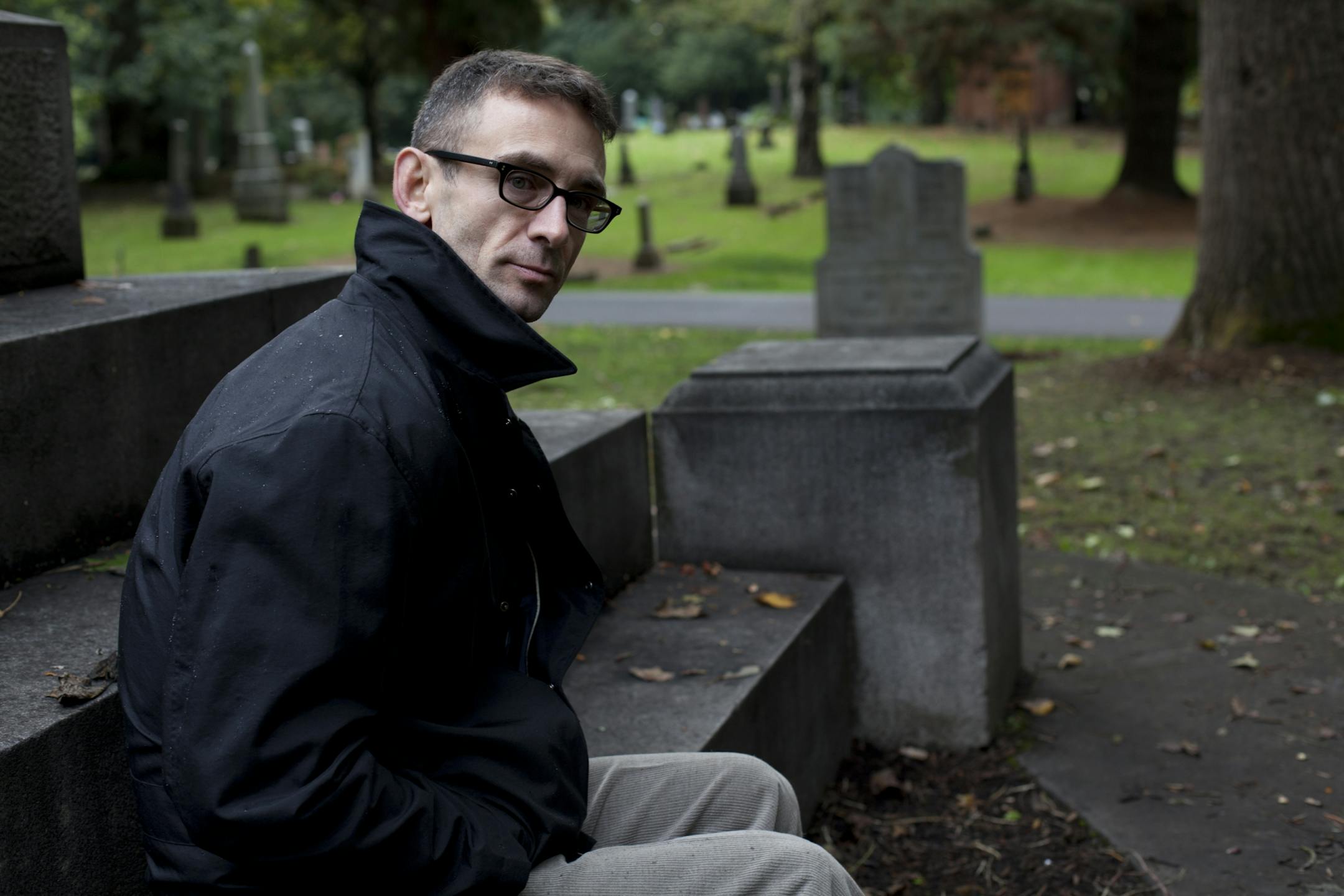 Chuck Palahniuk in Portland, Oregon. (cemetary is Lone Fir Cemetary) Image � Tim LaBarge
