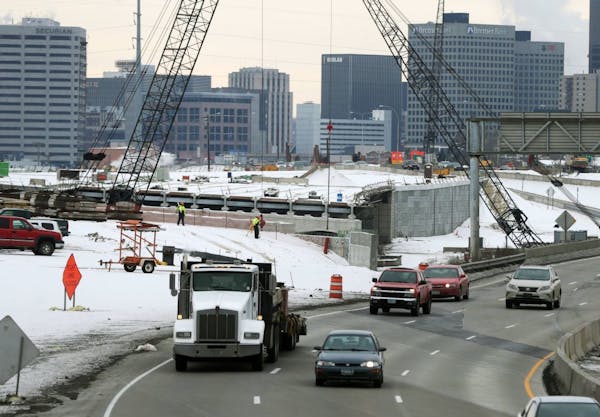 FILE - In this Dec. 2, 2014 file photo, construction continues on Interstate 35E in St. Paul, Minn. Democrats and Republicans agree that Minnesota nee
