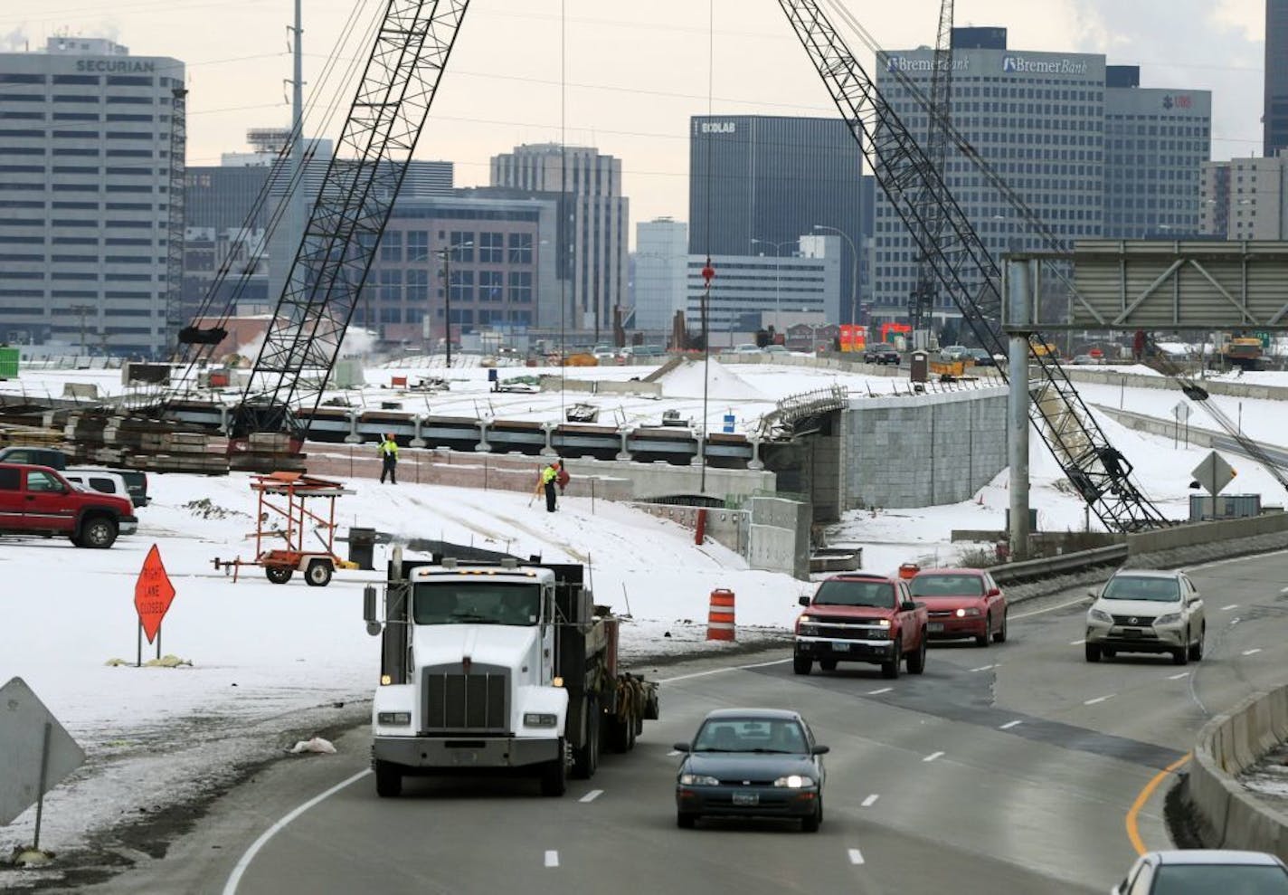 FILE - In this Dec. 2, 2014 file photo, construction continues on Interstate 35E in St. Paul, Minn. Democrats and Republicans agree that Minnesota needs hundreds of millions in new spending on roads and bridges to catch up to the state's needs. Gov. Mark Dayton is to release a separate transportation package Monday, Jan. 26, 2015, one day before he outlines his $40 billion-plus budget proposal.