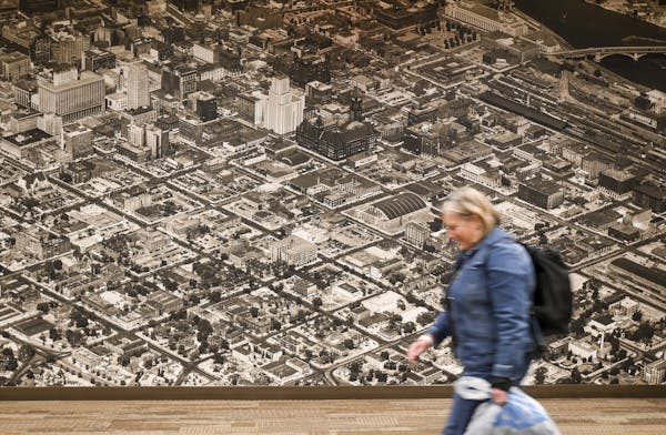 Large historical panoramas hang in the Wells Fargo Bank building's skyway in Downtown East.