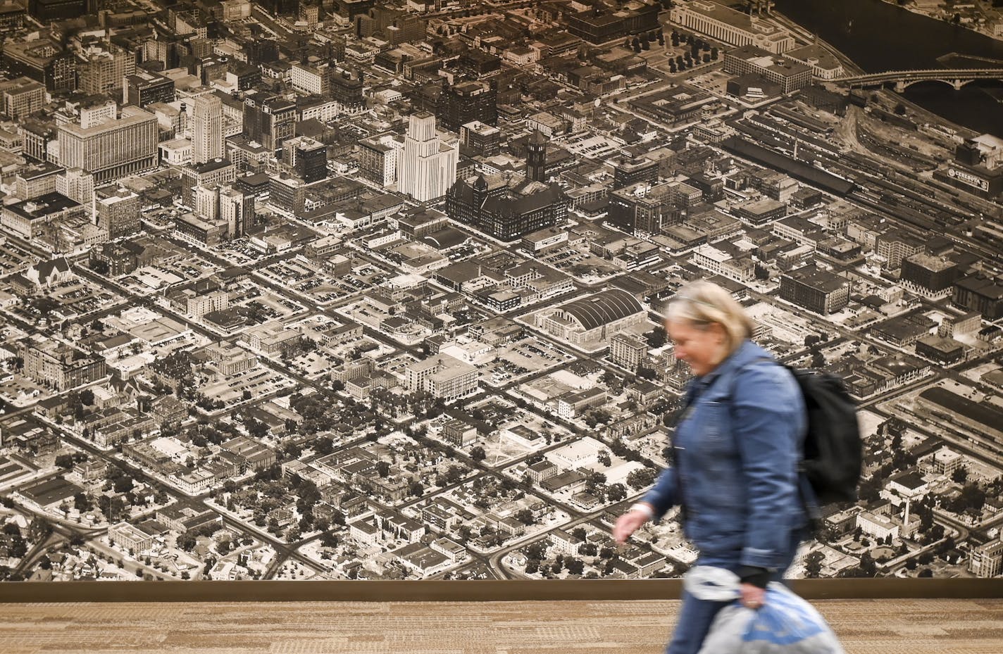 Large historical panoramas hang in the Wells Fargo Bank building's skyway in Downtown East.