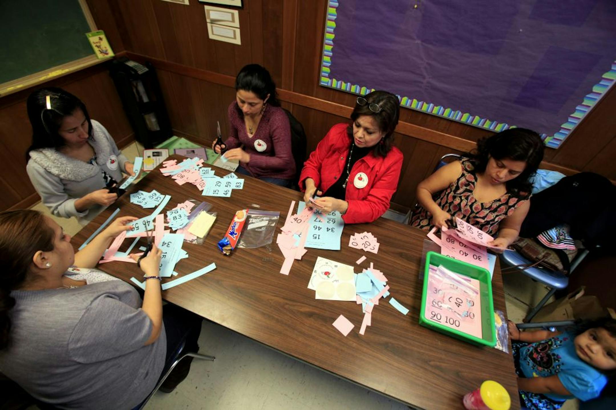 School volunteers cut out flash cards for students at North Park Elementary in Fridley earlier this year.