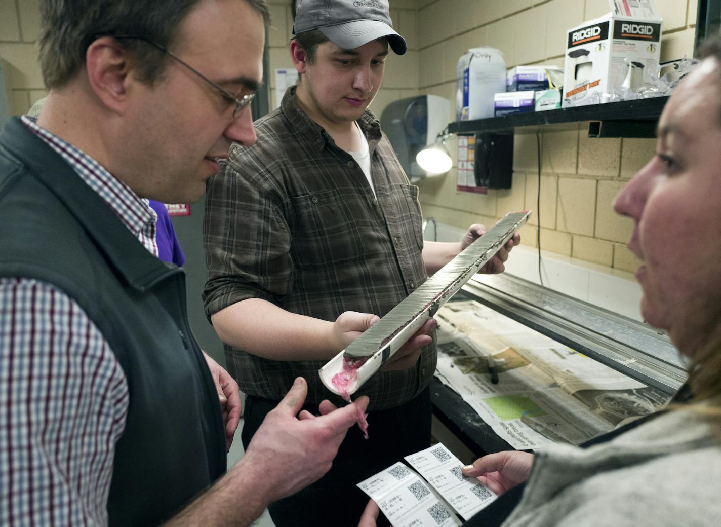 Dr. Andrew Breckenridge associate professor of geology at UW Superior left worked with students Nik Langevin and Morgann Shanoff as they examined a core mud sample at the U of M Limnologiscal Research Center Thursday April 28, 2016 Minneapolis, MN.] Students from the University of Wisconsin-Superior spent the day a the University of Minnesota Limnological Research Center examining core samples of mud taken from lakes in northern Minnesota. Jerry Holt /Jerry.Holt@Startribune.com