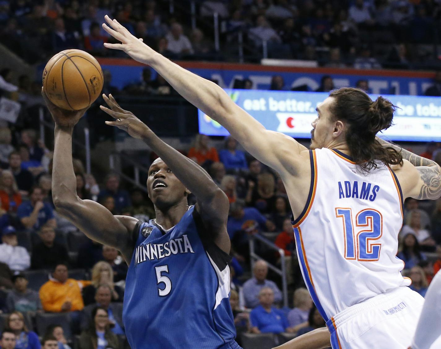 Timberwolves center Gorgui Dieng shot as Thunder center Steven Adams (12) defended in the first quarter in Oklahoma City on Friday.