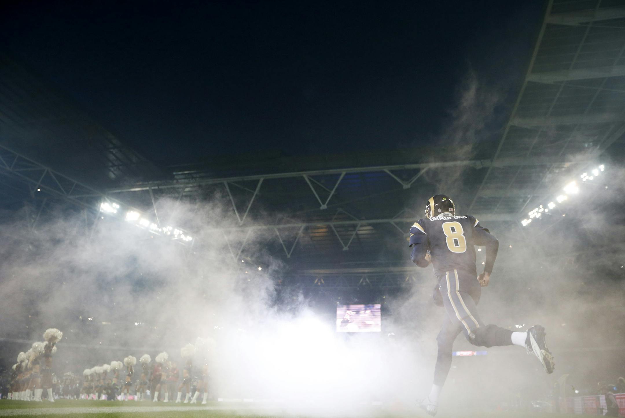 St. Louis Rams quarterback Sam Bradford enters the field prior to the start of a NFL football game between the St. Louis Rams and New England Patriots at Wembley Stadium, London, Sunday, Oct. 28, 2012. (AP Photo/Matt Dunham) ORG XMIT: NYOTK