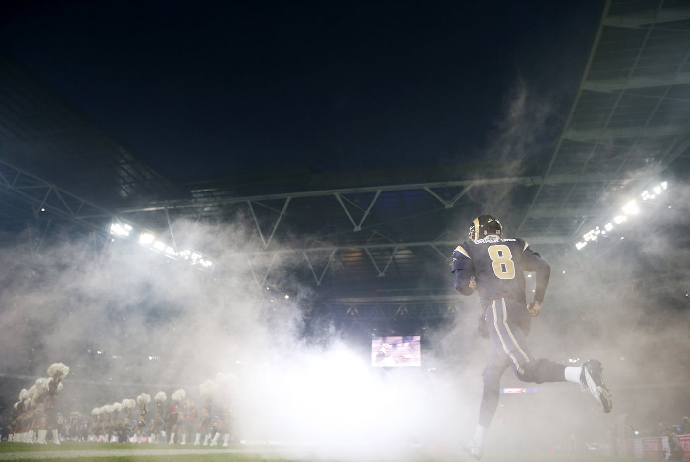 St. Louis Rams quarterback Sam Bradford enters the field prior to the start of a NFL football game between the St. Louis Rams and New England Patriots at Wembley Stadium, London, Sunday, Oct. 28, 2012. (AP Photo/Matt Dunham) ORG XMIT: NYOTK