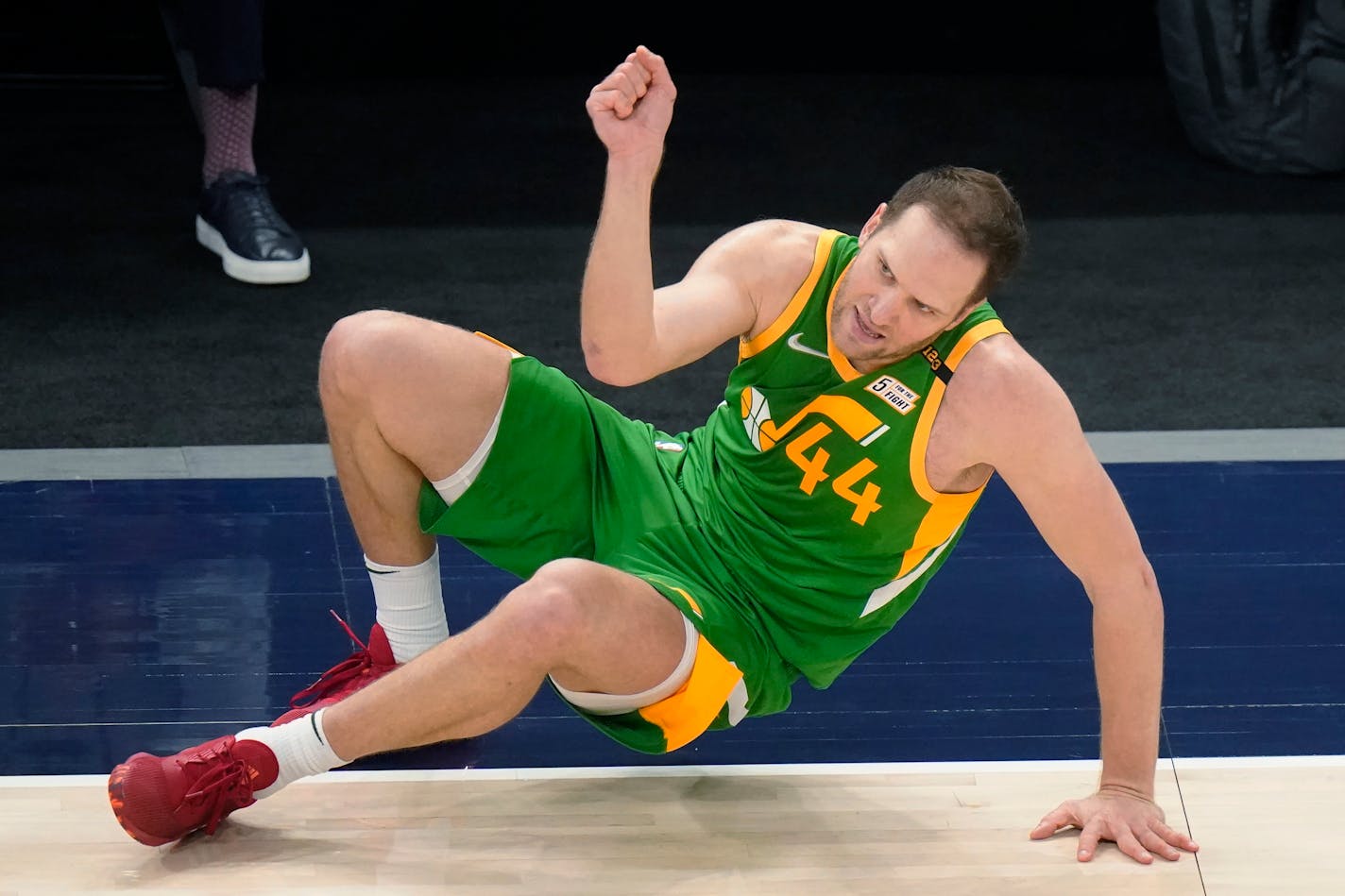 Utah Jazz forward Bojan Bogdanovic (44) falls after making a 3-pointer against the Minnesota Timberwolves during the second half of an NBA basketball game Saturday, April 24, 2021, in Salt Lake City. (AP Photo/Rick Bowmer)