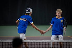 Thomas Prondzinski, left, and Ethan Turunen, Wayzata's second doubles team, react to scoring against Rochester Mayo during the Class 2A team final.