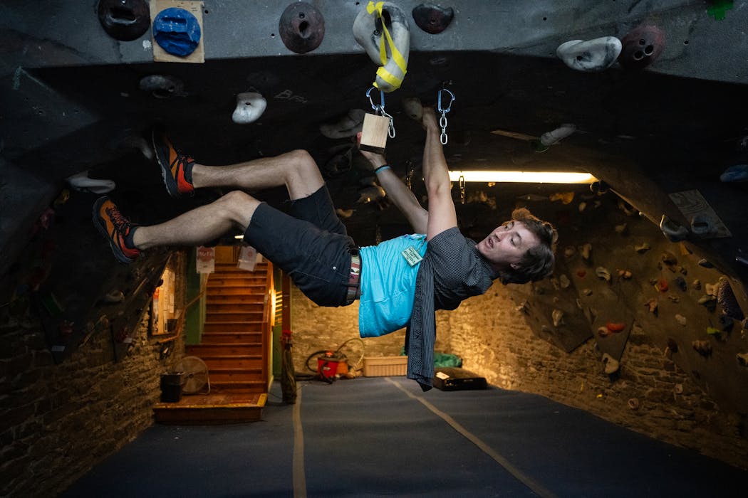 Evan Flack took a break in the climbing space inside Midwest Mountaineering in Minneapolis on Wednesday.