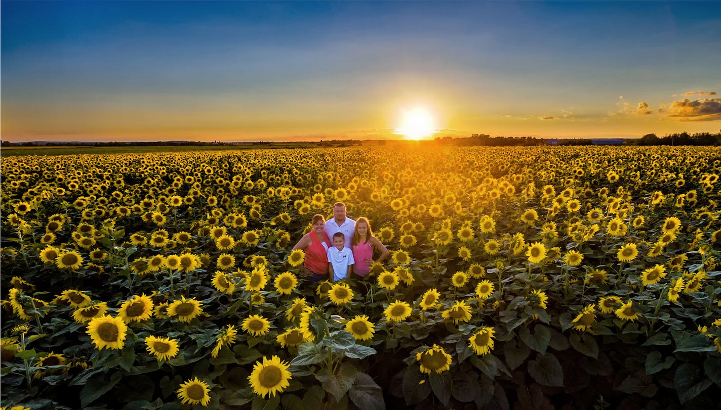 On the family pictures the names are Jenni, Mitchell Smude (our son), Katelyn Smude (our daughter), and Tom Smude in the sunflowers. Credit: Dan Vang Photography