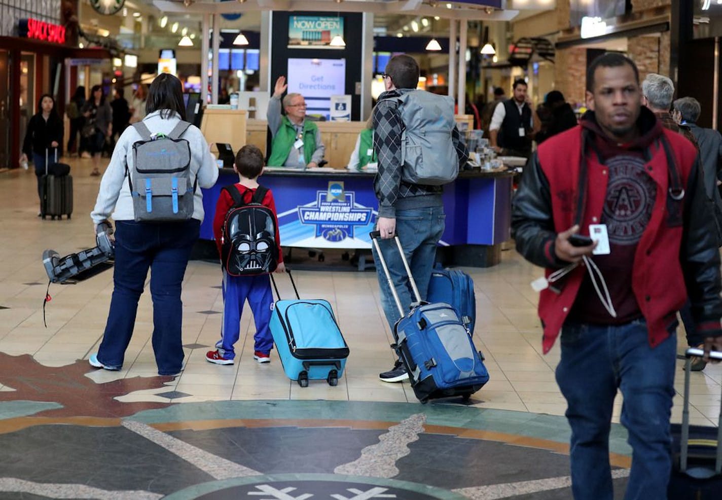 Travelers in terminal 1at MSP Airport Wednesday, March 4, 2020, in Minneapolis, MN. It was revealed during the press conference debuting the new REAL ID Office that two people arriving at the Minneapolis-St. Paul Airport on Tuesday have been instructed to self-quarantine themselves for 14 days due to their "close contact" with someone in Europe who has been infected with the novel coronavirus that is spreading across the globe.