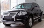 Novosibirsk, Russia - 08.01.2018: Black Volkswagen Touareg 2008 release with an engine of 6 liters W12 front view on the car parking in the service ce